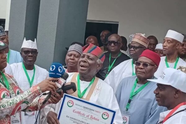 JONATHAN PRESENTS PDP CERTIFICATE OF RETURN TO PROF JERRY GANA IN PARTY.