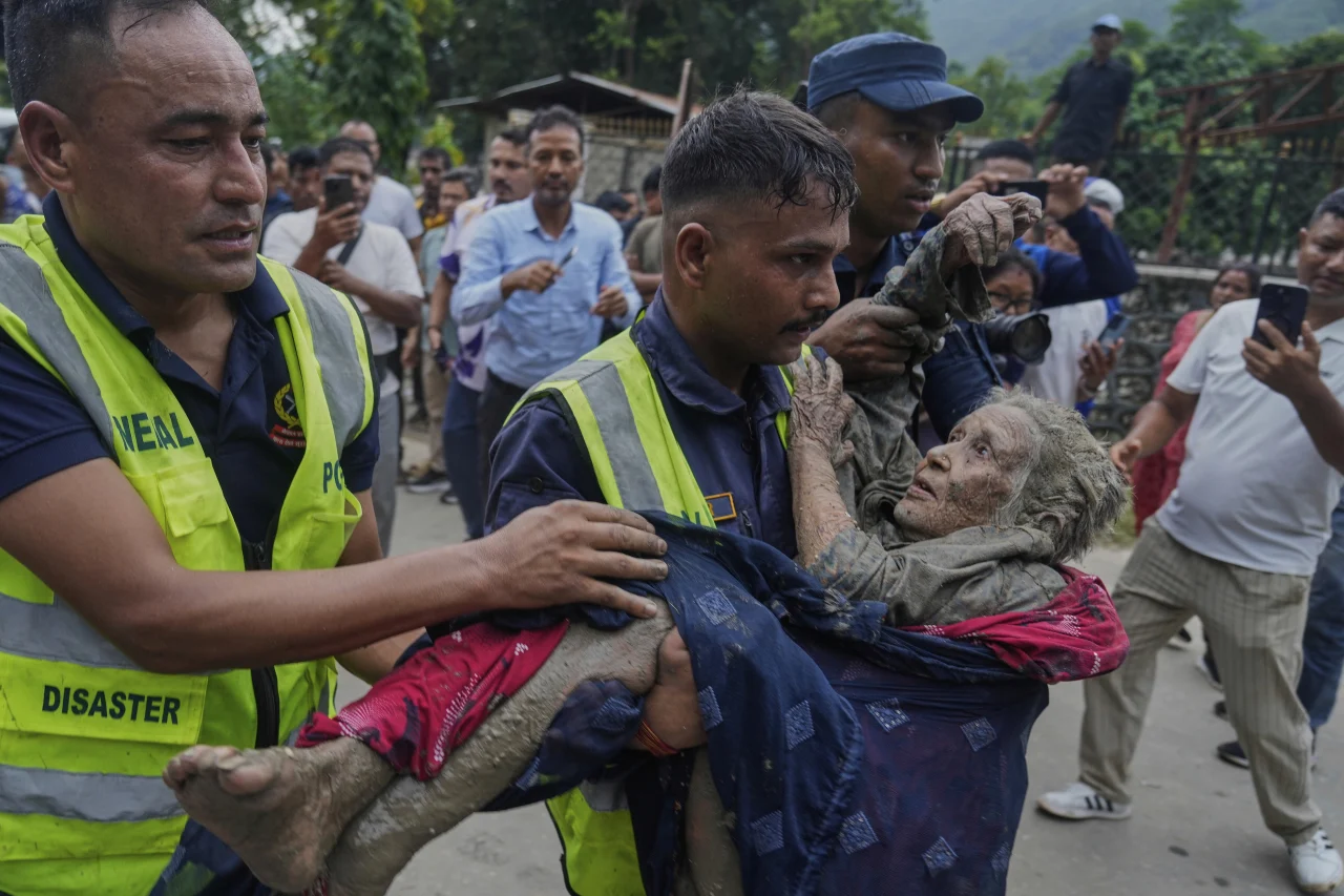 RESCUE OPERATIONS INTENSIFY IN NEPAL AND CHINA AS FLOOD DEATH TOLL RISES.